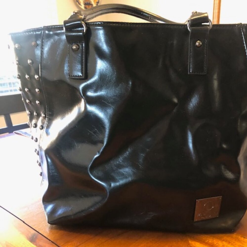 Maite Perroni black studded tote